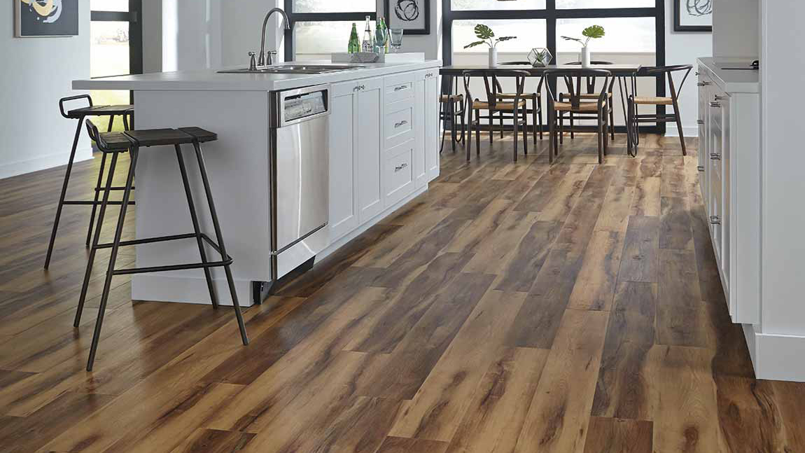 Luxury vinyl flooring in a kitchen, installation services available.